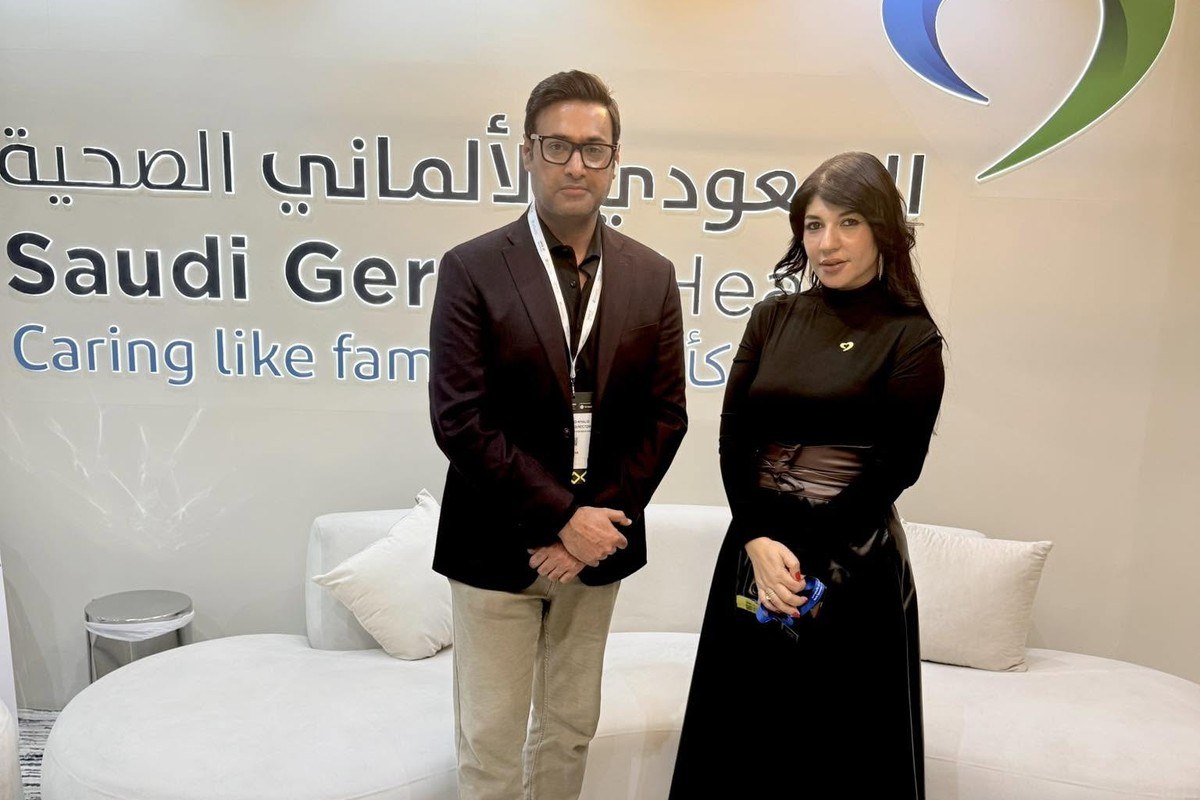 Khalid Sattar with Dr. Azza Ahdy at the Saudi German Health booth